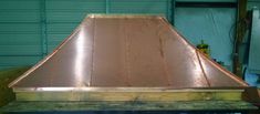 a copper colored metal roof in a garage