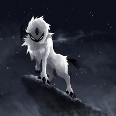 a white and black furry animal standing on top of a rock in the dark sky
