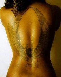 the back of a woman with tattoos on her body