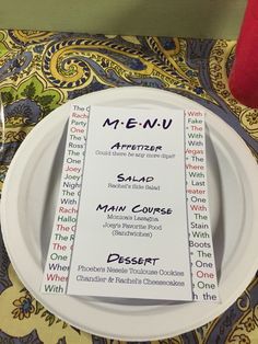 a plate with a menu on it sitting on a table