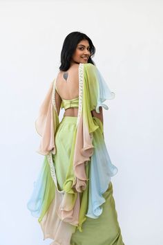 Flow dreamily into any ensemble with the Kavi Multiway Dupatta. Created from a luxurious silk crepe fabric, this stole's ombre pattern of rose, ice blue, and pista creates a captivating effect. The delicate handwork of pearls on the border highlights the dupatta's beauty. Constructed with wire bidding for a flowy texture, it's a decadent touch for your wardrobe. Features: pearl work border throughout entire piece ombre color-way of rose, ice blue, and pista can be styled in multiple ways please Couture, Sangeet Outfits, Ombre Clothes, Silk Crepe Fabric, Blazer Design, Drape Gown, Dupatta Designs, Casual Trendy Outfits, Long Blouse Designs