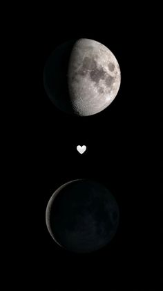 the moon and heart shaped object are in the dark sky