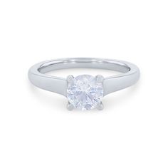 a white gold ring with a single diamond