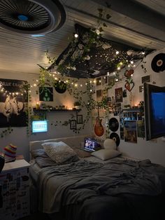 a bedroom with plants hanging from the ceiling