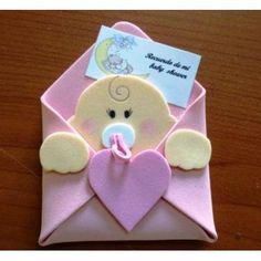 an origami envelope with a teddy bear in it