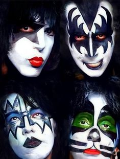four people with face paint on their faces