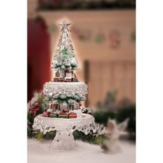 a small christmas tree on top of a cake