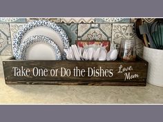 a wooden sign that says, take one or do the dishes love mom on it