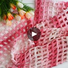 two crocheted blankets sitting next to each other on top of a white table