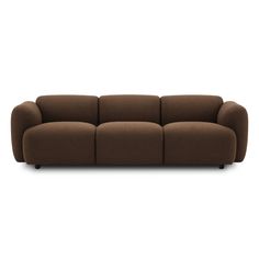 a brown couch sitting on top of a white floor