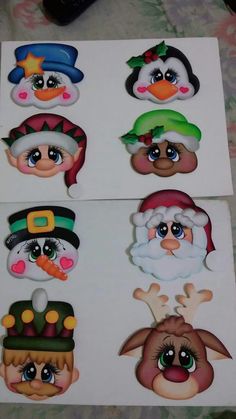 six christmas stickers with different faces on one side and two in the middle, all decorated to look like santa claus