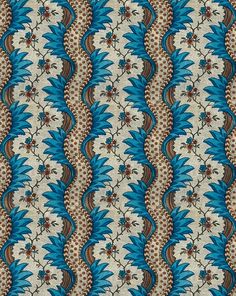 a blue and brown pattern with flowers on it's side, in the middle of an ornate design