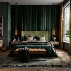 a bedroom with green curtains and a large bed in the center, along with two lamps on either side of the bed