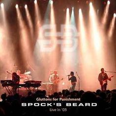 a band playing on stage with spotlights in the background and text that reads guitars for punishment spock's beard live in 05