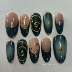 the nails have been painted with different colors and designs on them, including gold accents