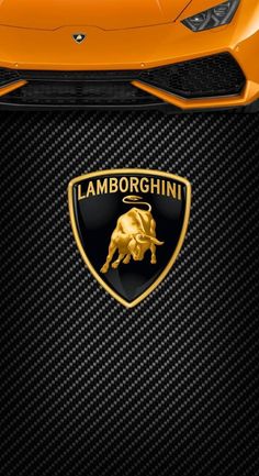 an orange lamb logo on the front of a sports car with black carbon fiber and gold foil