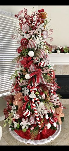 a christmas tree decorated with candy canes and bows