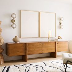 a living room with two framed pictures on the wall