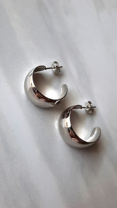 Dimensions: 22x11mm  Classically Stylish Thick Half Hoop Stainless Still Silver Earrings Durable and Comfort to wear, No matter the occasion, wearing these beautiful polished earrings will complete your everyday look! * Hypoallergenic * High quality Stainless Steel 316L * Tarnish-Resistant, it doesn't leave stains on your skin. Waterproof. * Easy to clean with soft cloth. Thanks for your visit! <3 Thick Earrings Hoop, Thick Hoop Earrings Silver, Silver Everyday Earrings, Earrings Hoops Silver, Clean Girl Silver Jewelry, Thick Silver Hoops, Silver Girly Jewelry, Thick Silver Hoop Earrings, Chunky Hoop Earrings Silver