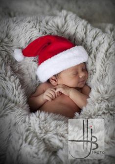 a newborn baby wearing a santa hat