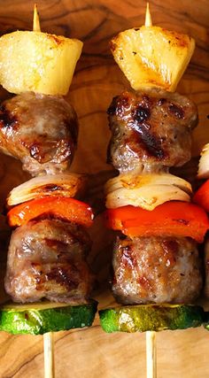 the skewers are filled with meat and vegetables