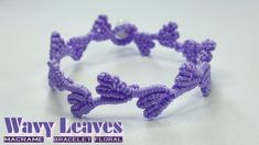 a close up of a purple crochet bracelet on a white surface with the words way leaves above it