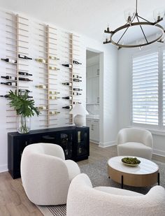 a living room filled with furniture and a wine rack