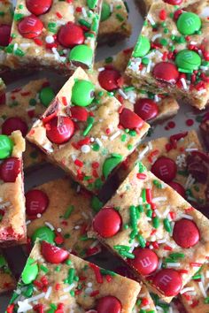 santa's peanut butter squares with candy and sprinkles are on a plate