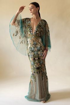 Marchesa mesh v-neck gown in peacock. 92% Silk, 8% Elastic, Lining: 100% Nylon Dry Clean Only Made in USA Couture, Haute Couture, Marchesa Couture, Emerald Gown, Crystal Gown, Exclusive Gowns, Peacock Pattern, Fashion Gowns, Sleeveless Gown