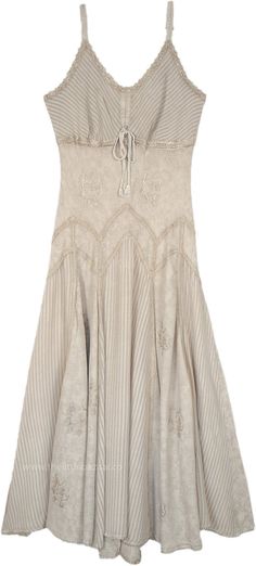 A summer maxi dress in beige with lace details around the neckline and hem, this sleeveless dress has vertical panels that add flair and feminine flow to it.  The front of the dress has a tie-up lace style. #tlb #Sleeveless #SummerDress #westerndress #renaissancedress #medievaldress Marceline Fashion, Dress Medieval, Cream Colored Dress, Dress Western, Dresses Beige, Loungewear Dress, Western Dress, Lace Style, Trendy Skirts