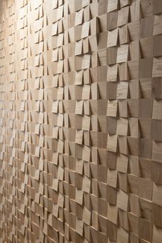 a wall made out of wooden planks in an office building with wood flooring