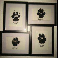 four black and white framed pictures with mickey mouse's faces drawn on the wall