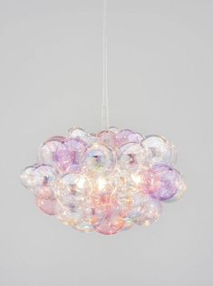 a chandelier made out of bubble balls hanging from the ceiling