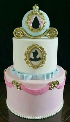 a three tiered cake decorated with an image of a princess on the top layer