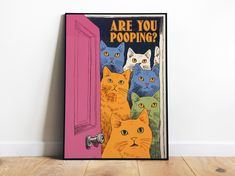 there are many cats that are standing in front of the door and looking at you