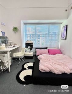 a bedroom with a bed, desk and chair next to a window in the room