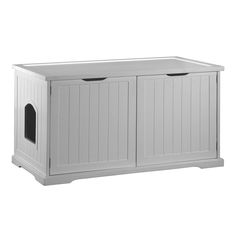 a white wooden dog house with two doors