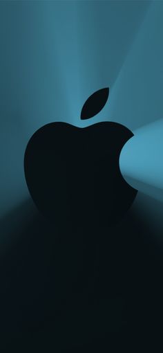 an apple logo is shown in the dark with light coming from it's center