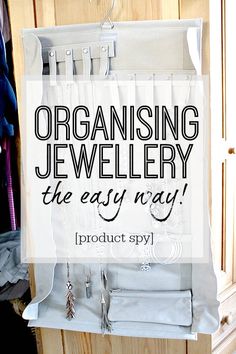 an organized jewelry organizer hanging on the wall with text overlay that reads, organizing jewelry the easy way product spy