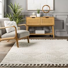 a living room with a chair, table and rug