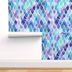 the wallpaper is decorated with blue and purple fish scales