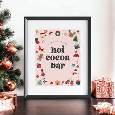 a framed poster with the words not cocoa bar surrounded by christmas decorations and presents on a table