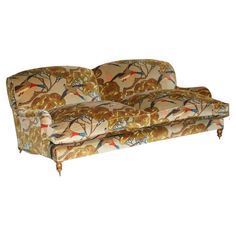 an old fashioned couch with birds on it