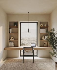 a room with a desk, shelves and a chair in front of a large window