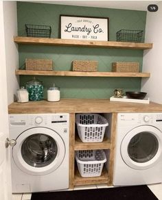 a washer and dryer in a laundry room with shelves above the washer