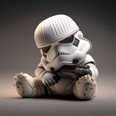 a star wars character sitting on the ground