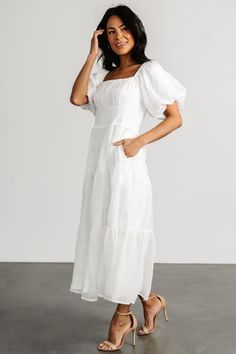 Add a gorgeous new maxi dress to your collection with our Rina Embroidered Shimmer Dress in Off White! Embrace the shimmery material and cute puff sleeves that make the Rina stand out from the crowd. Sun Dresses Modest, Cute Church Dresses, Dresses For Engagement Pictures, White Baptism Dress, Short Sleeve Bridesmaid Dress, White Floral Midi Dress, Modest Summer Dresses, Midi Dress Blue, Cute Maxi Dress