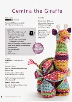 a crocheted giraffe sitting on top of a pile of balls