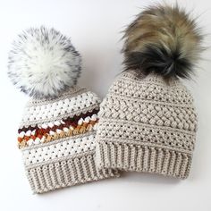 two knitted hats with pom - poms on top of each other, one white and one brown