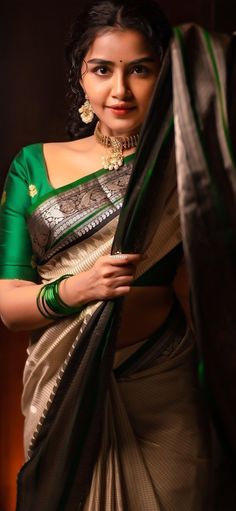 a woman in a green and white sari